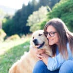 Young,Woman,Hugging,Beautiful,Dog.,Happy,Girl,And,Labrador,Retriever