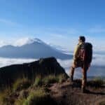 Asian,Adventure,,Man,Model,On,Mountain,Summit,,Carrying,Hiking,Gear